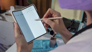Writing on the Samsung Galaxy Z Fold 4's larger display with the S Pen